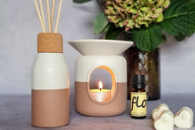 Load image into Gallery viewer, Ceramic wax melter and oil warmers and reed diffuser bottles.
